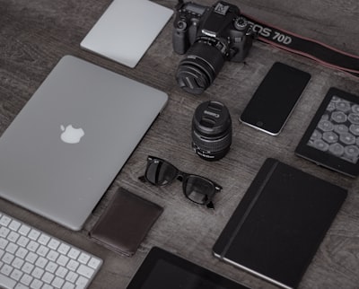 Photographer at the desk, office gadgets and object lens Stock