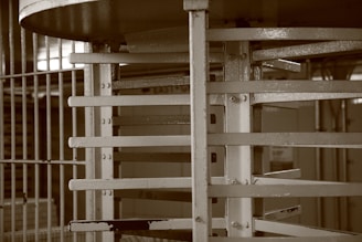 Semi-automatic disinfection gate positioned in an industrial setting.