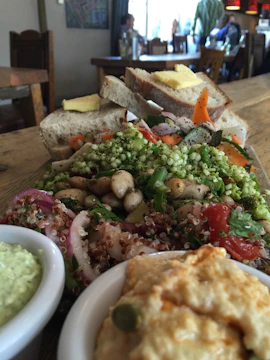A vibrant spread of fresh salads and wraps served at a corporate workshop table.