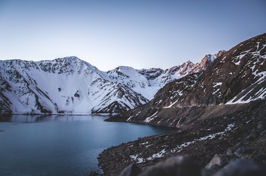 snowy mountain under blue sky in El Yeso Dam Chile