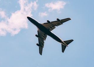 low angle photography of airplane on the sky