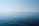 body of water under blue and white sky at daytime