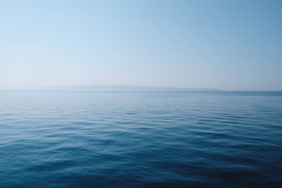 Deep ocean water with turbine silhouette