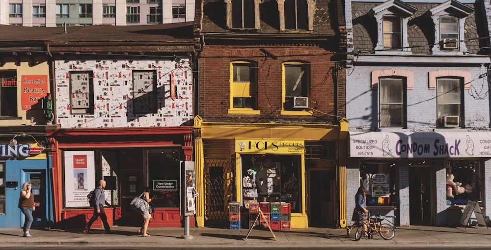 woman standing in front of red store during daytime