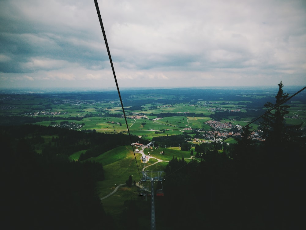 zipline down to green trees