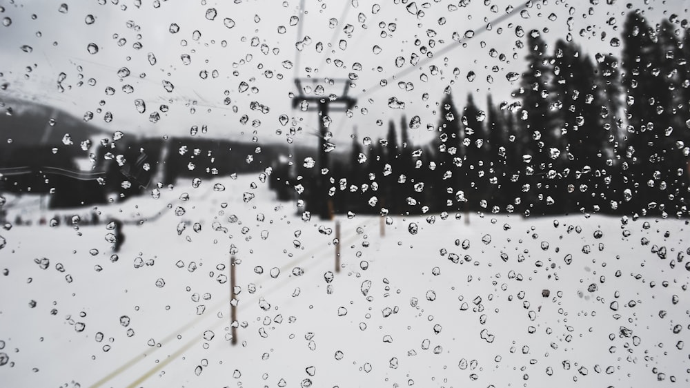 a window with rain drops on the glass