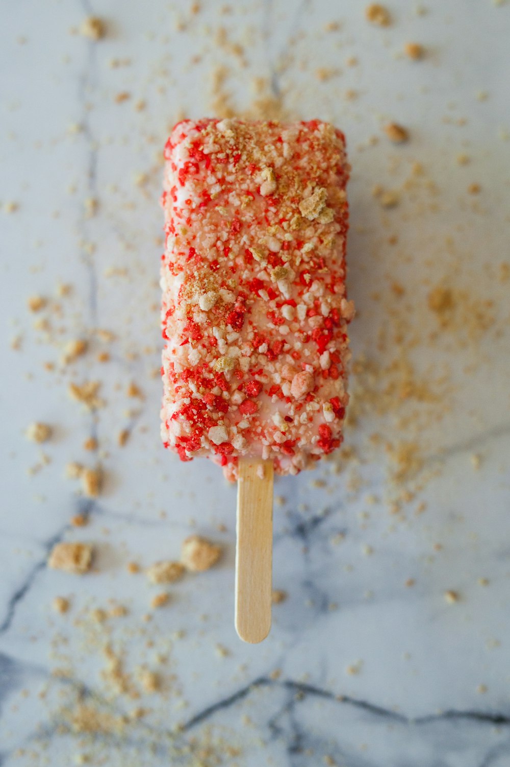 focus photography of drumstick ice cream with toppings