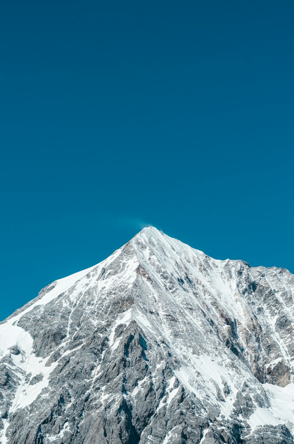 snow covered mountain during daytime