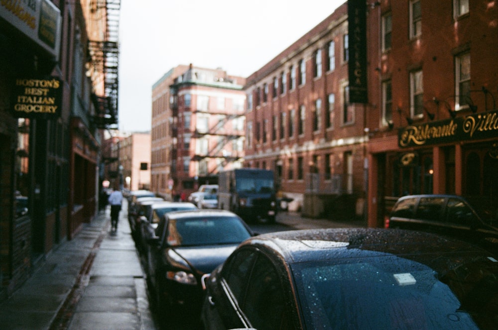 black cars lined up beside building