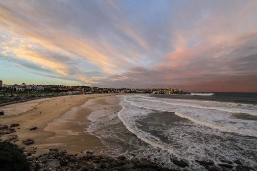 A panoramic view of the tranquil beaches near Kanyakumari under a colorful sky.