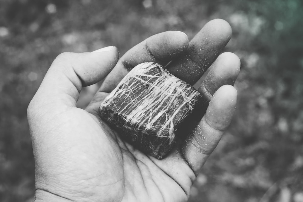 stone on person's hand