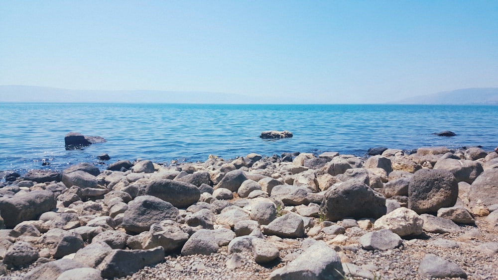 A rock covered ocean waterfront in Israel.