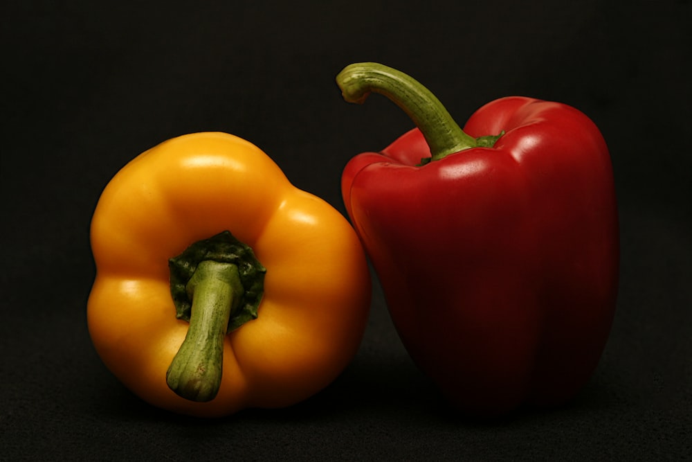 two red and orange bell peppers
