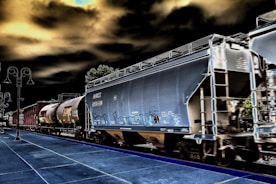 Railcars moving on tracks during a detailed inspection process