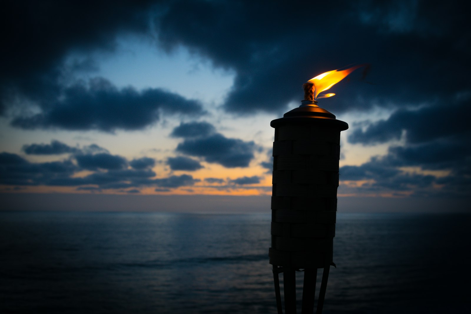 Nikon D7100 + AF Zoom-Nikkor 28-80mm f/3.5-5.6D sample photo. Lighted tiki torch near photography