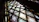Close-up of a handcrafted stained glass panel glowing warmly in natural light