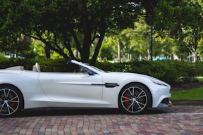 white Aston Martin convertible exotic car insurance progressive geico