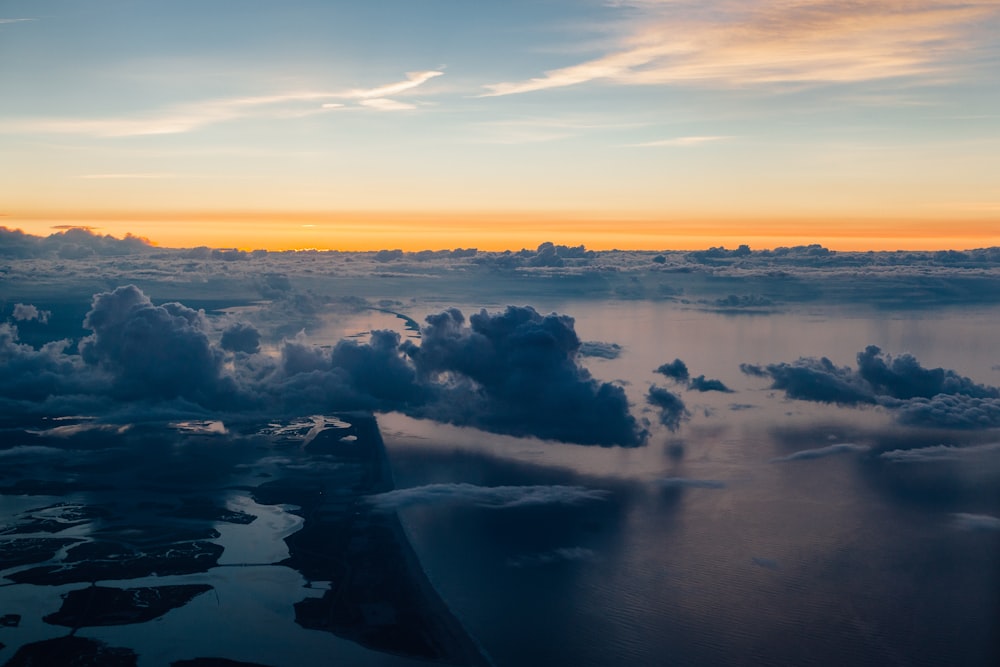 body of water under clouds