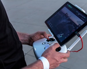 person holding quadcopter controller