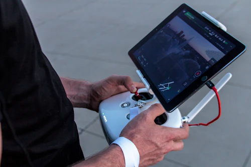 Person holding a drone controller