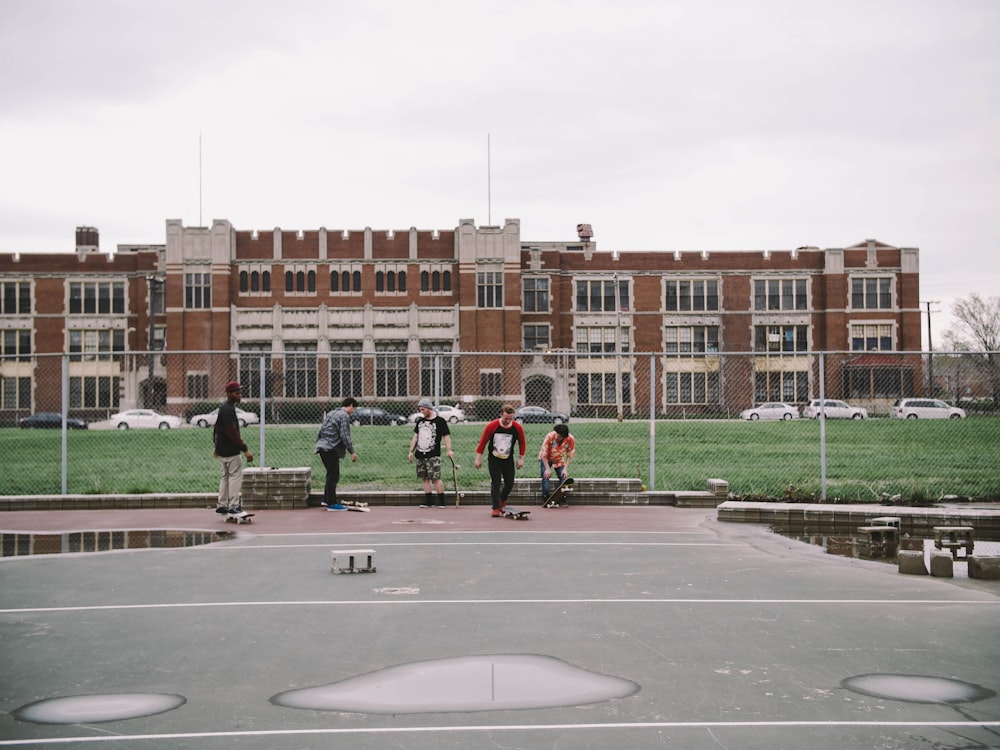 group of people near brown building