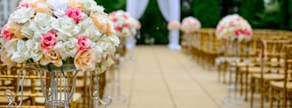 selective focus photography white and pink isle flower arrangement