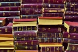 Close-up of legal books and documents on a wooden desk symbolizing years of expertise.