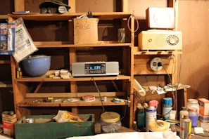 Shelf filled with diverse spare parts and accessories for home electronics