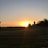 A serene landscape of the farm during sunset.