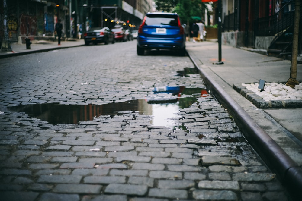 cars parked beside the sidewalk during day time