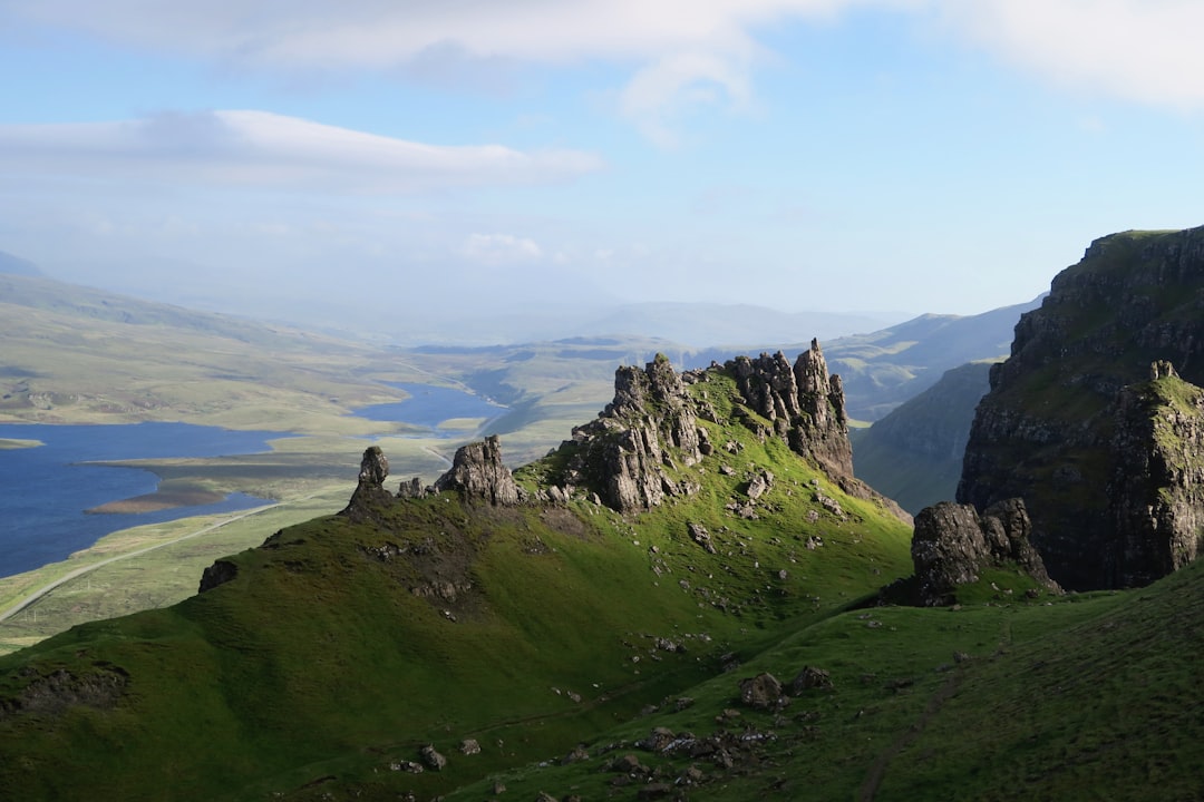 aerial photo of green grass field under blue sky, Distant view of a Scottish valley