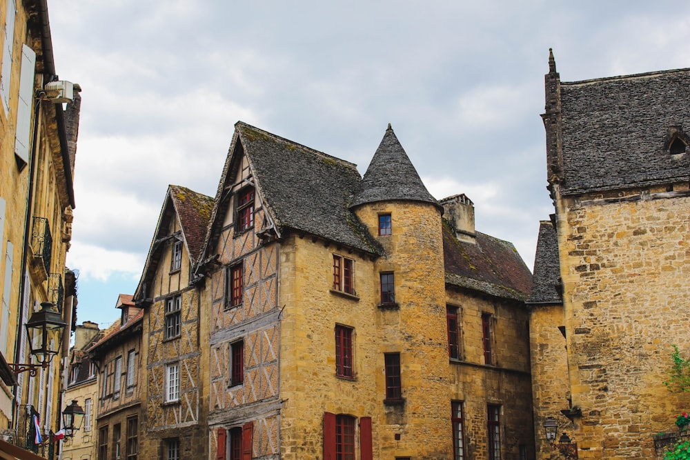 beige concrete houses under blue skies