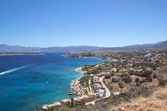 aerial view of green trees and blue sea during daytime in Agios Nikolaos Greece