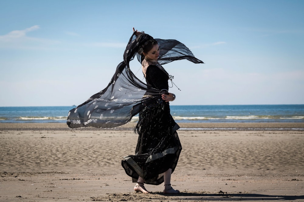 Romani person dancing on beach