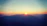 A serene sunset behind a mountain range symbolizing new beginnings.