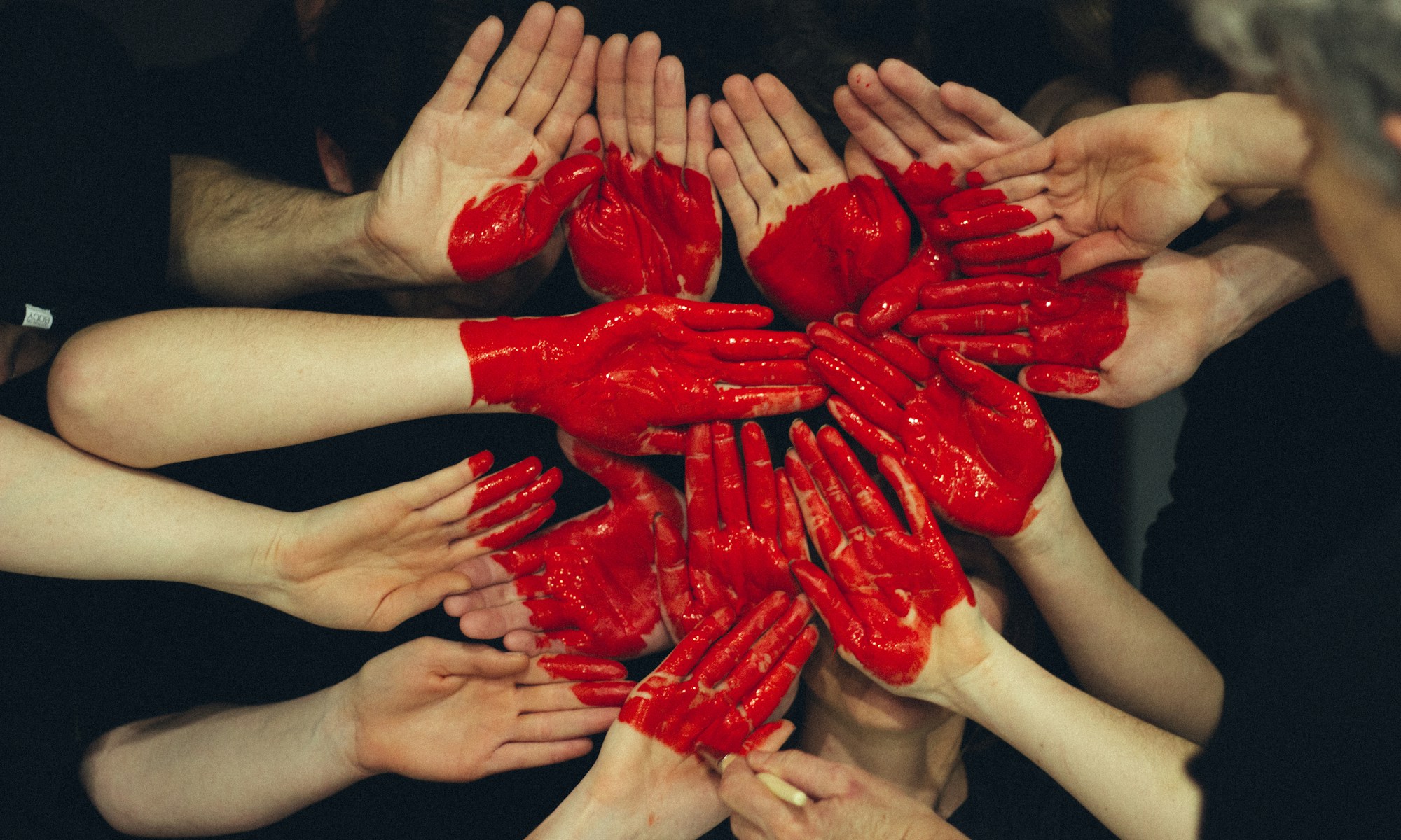 Videogames Courses Scotland. hands formed together with red heart paint