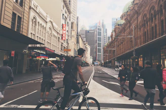 A bustling city street with pedestrians and cyclists using smart urban design.