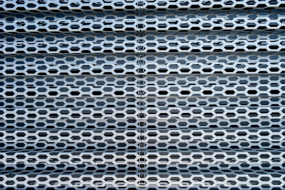 a close up of a metal structure with holes