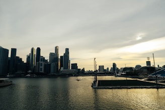 A vibrant Miami skyline with a sports stadium in the foreground during sunset.