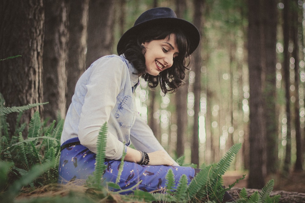 woman siting on selective focus photography