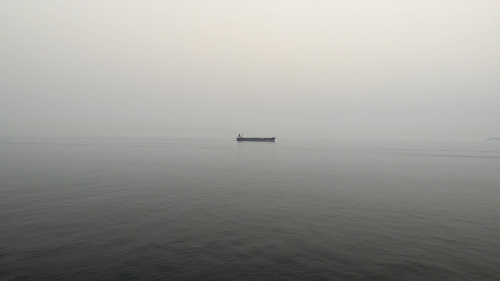 black boat on body of water