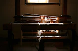 Rows of traditional wooden looms in the Bhadohi workshop bathed in soft natural light.