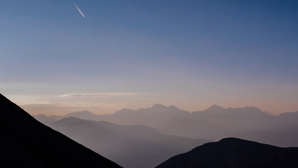 mountains under blue sky during daytime