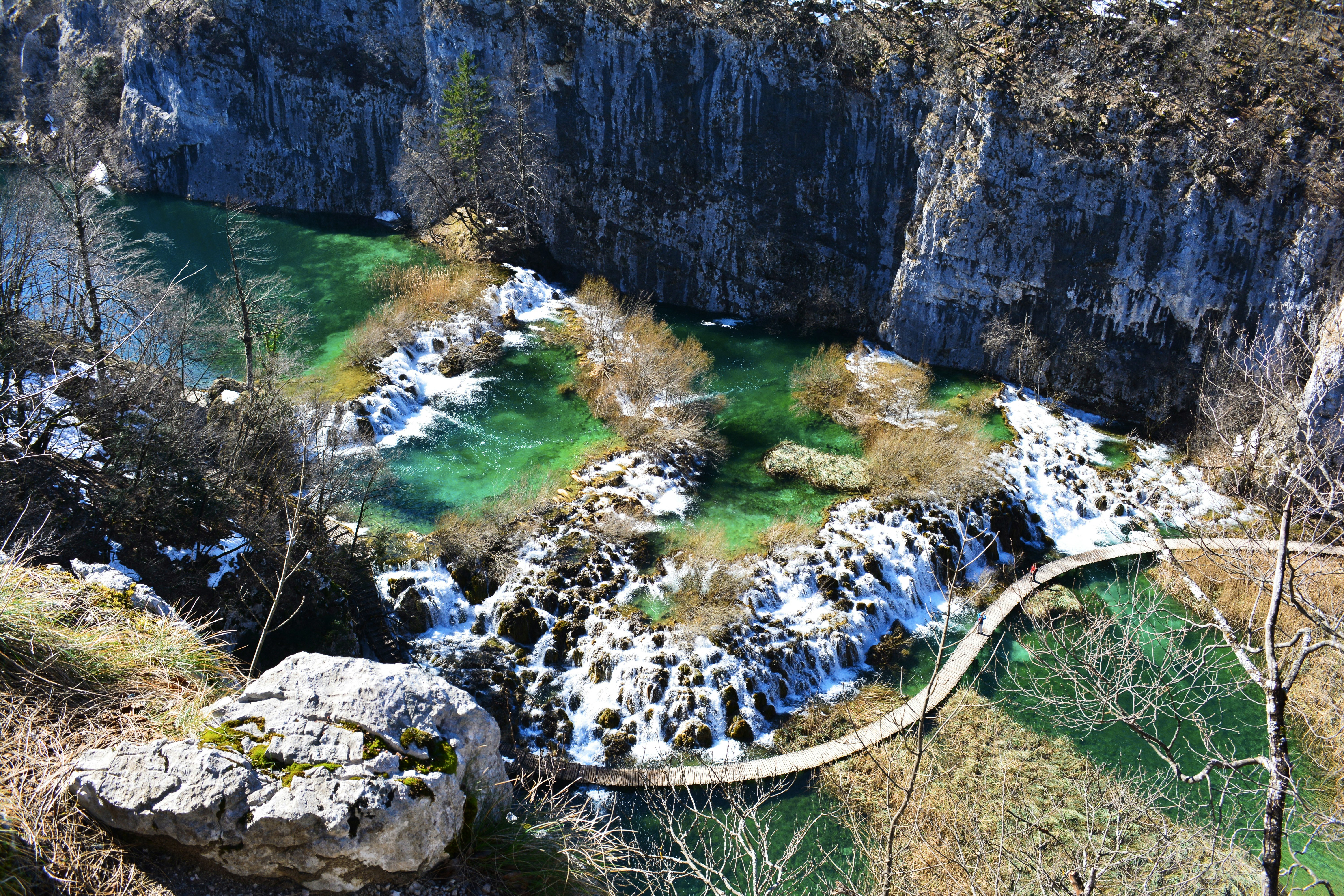 aerial photo of bridge near rock formation