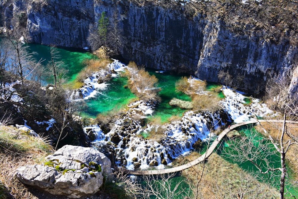 aerial photo of bridge near rock formation