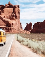 yellow Volkswagen van on road