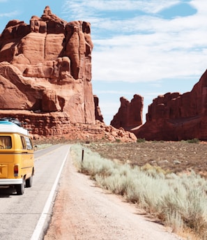 yellow Volkswagen van on road