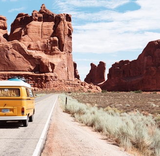 yellow Volkswagen van on road