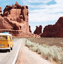 yellow Volkswagen van on road