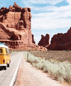 yellow Volkswagen van on road